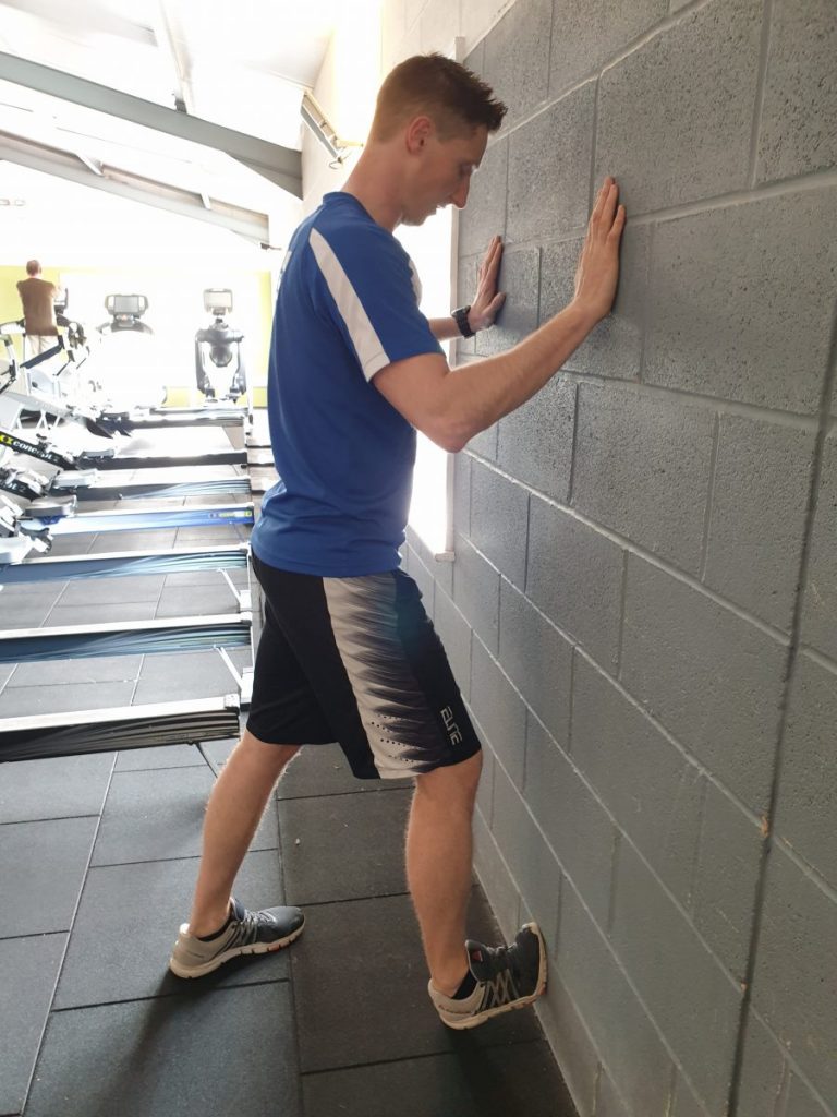 Calf stretch agains the wall